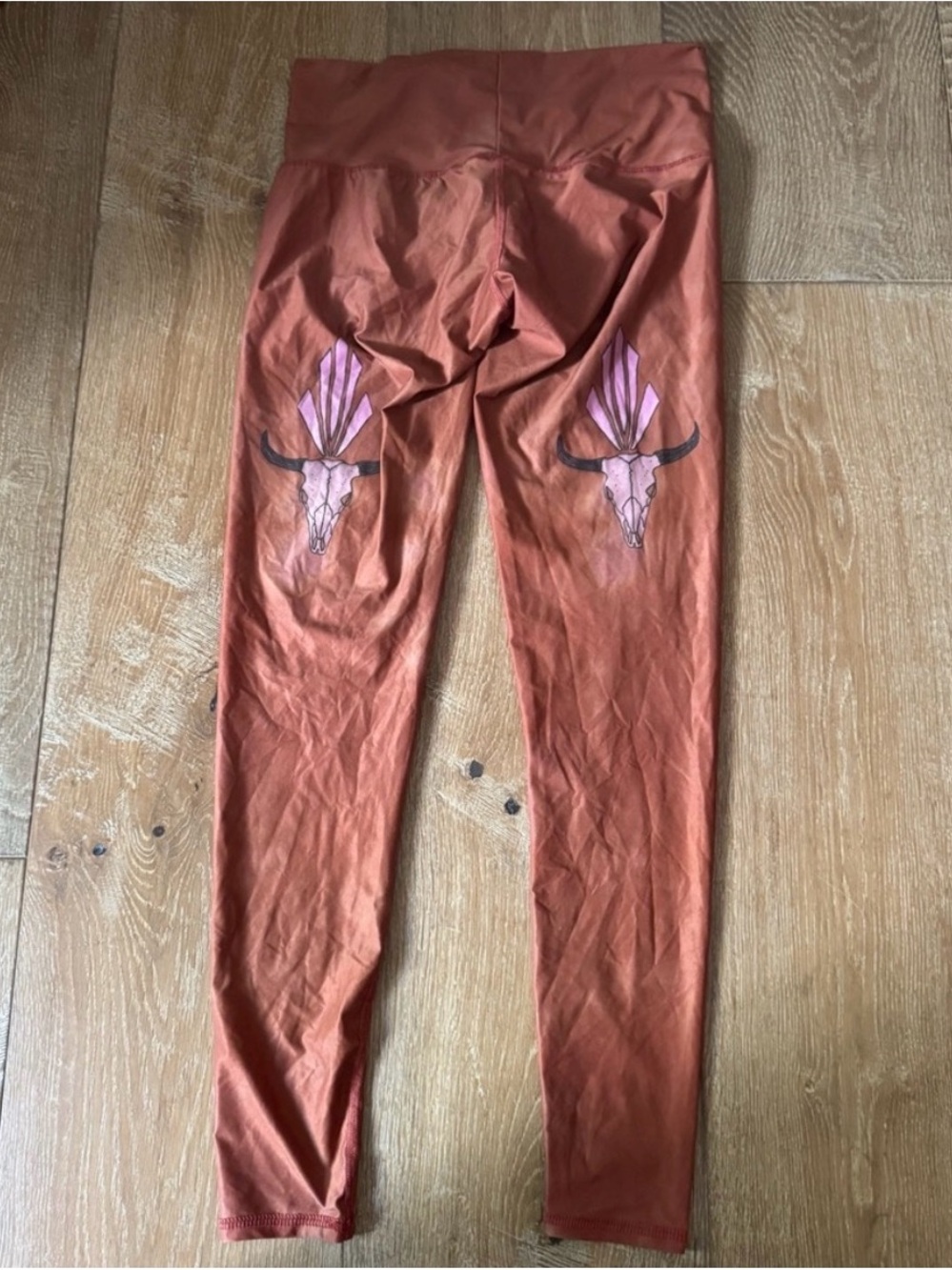 Teeki Size Medium Rust Orange Graphic Leggings with Pink Bull Skull